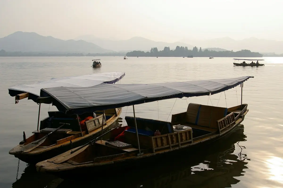 Boats on West Lake before sunset